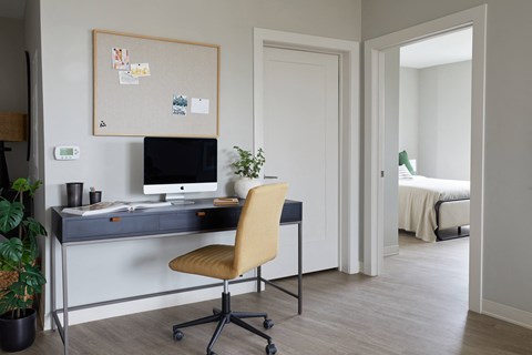a home office with a desk and chair