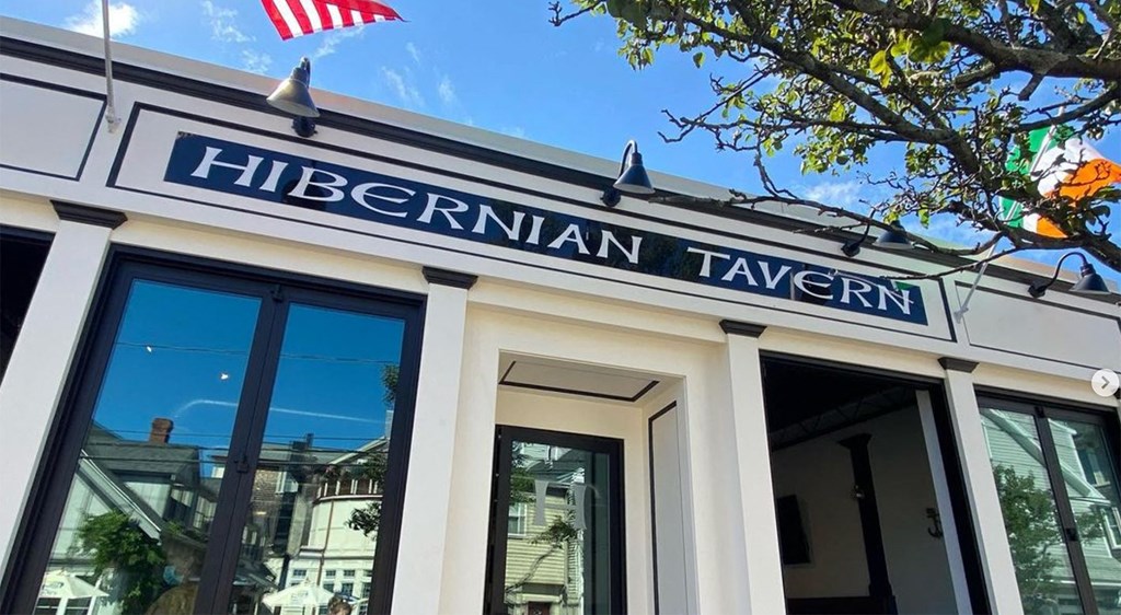 a restaurant with a sign on the front of it