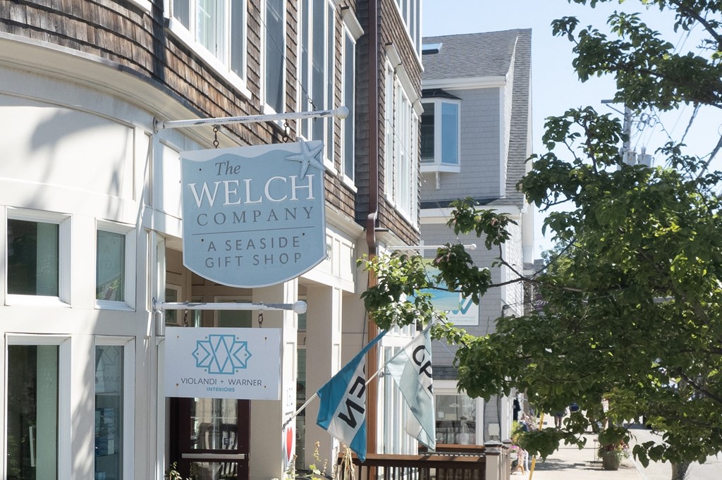 the facade of the welch company gift shop on a city street