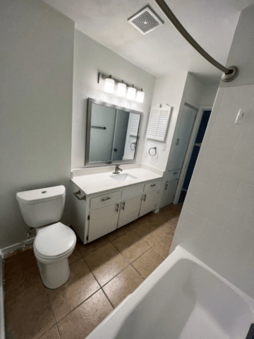 a bathroom with a toilet sink and bathtub