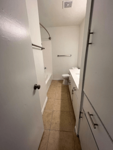 a bathroom with a toilet and a sink
