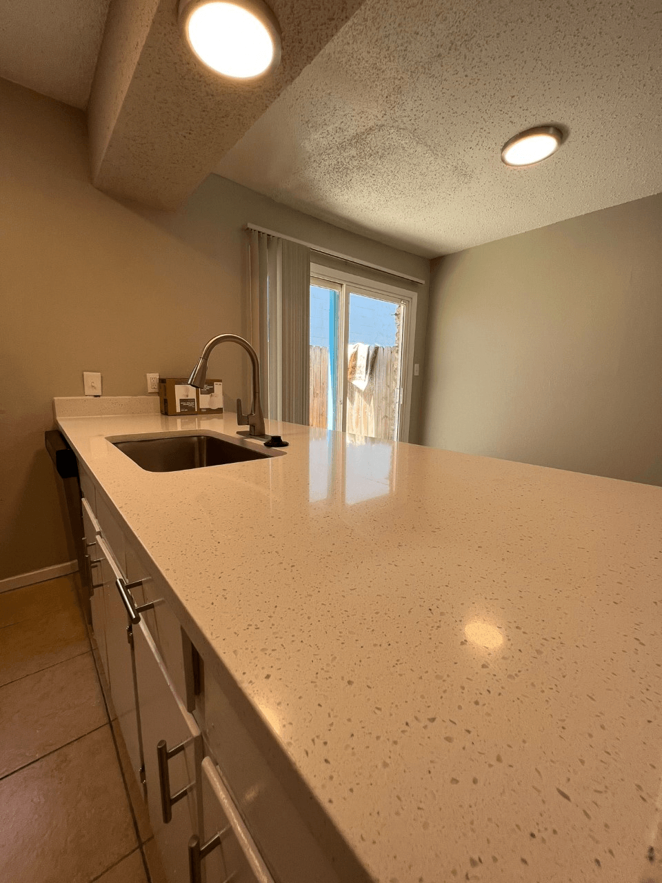 a kitchen with a sink and a window