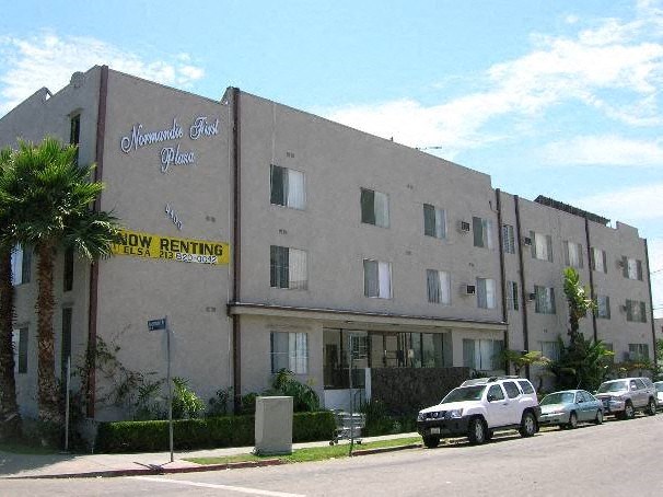 a large building with a yellow sign on the side of it