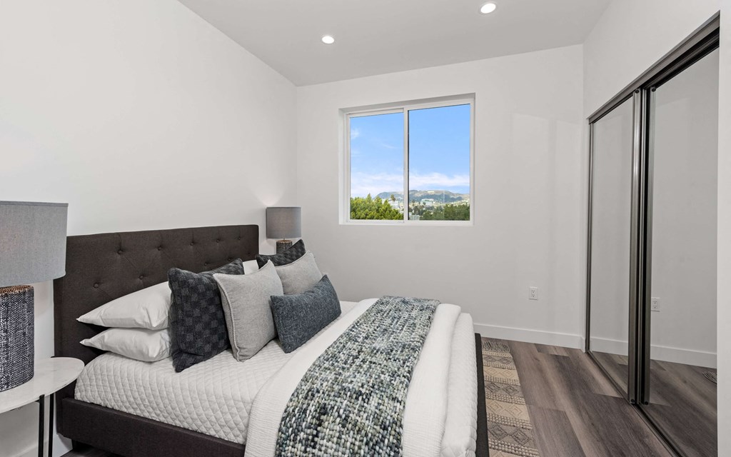 a bedroom with a large bed in a house