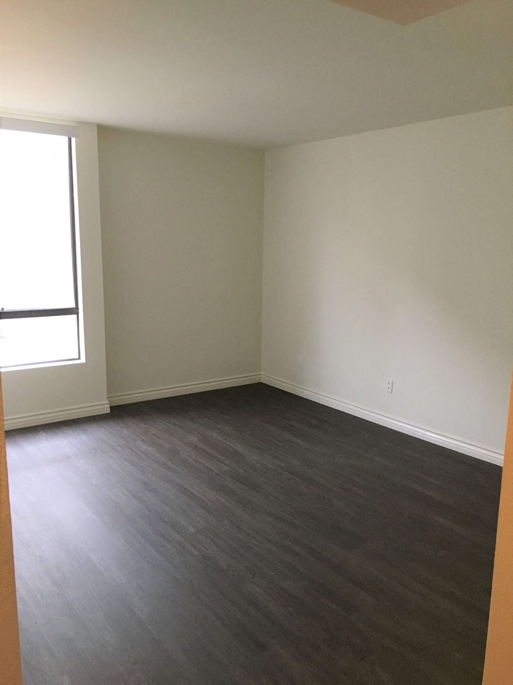 an empty room with a large window