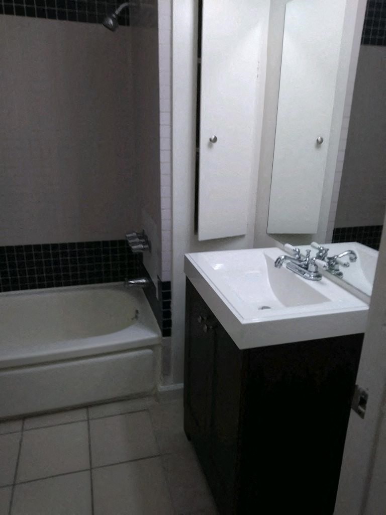 a bathroom with a sink and a bathtub