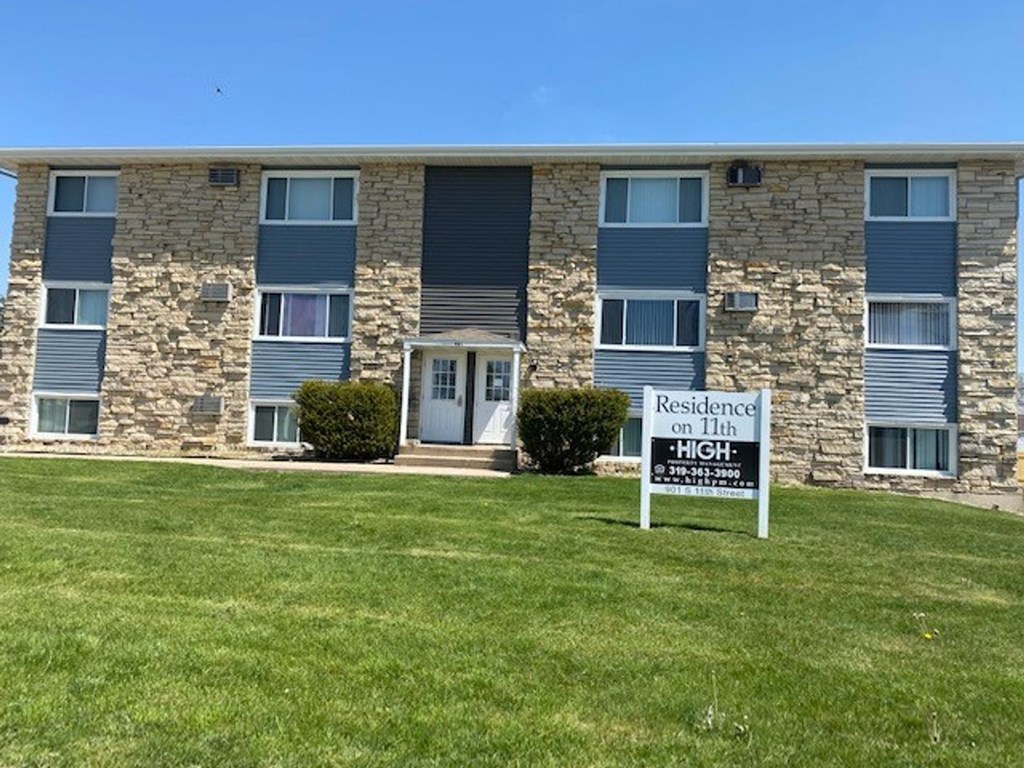 an apartment building with a reserved sign in front of it