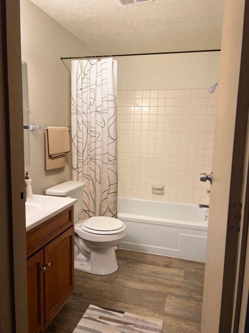 a bathroom with a toilet sink and bathtub