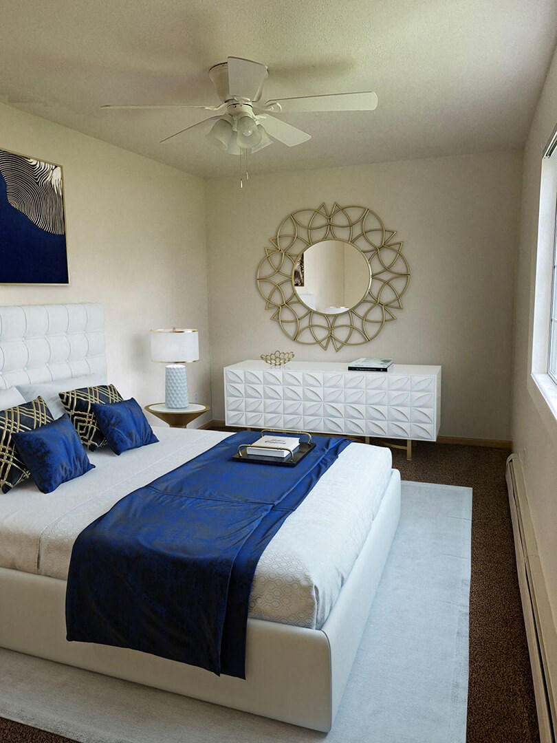 a bedroom with a bed and a ceiling fan