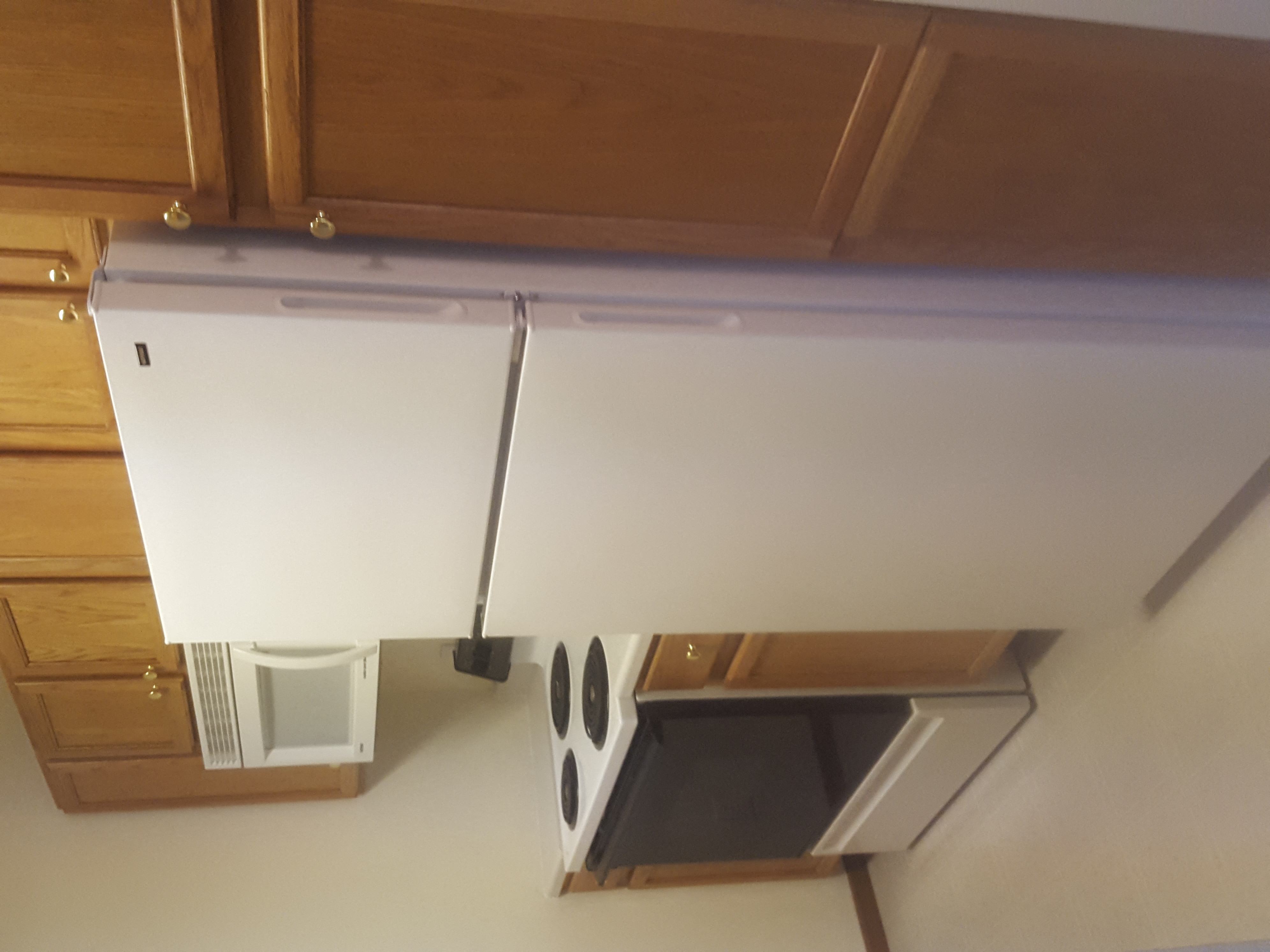 a view of the underside of a kitchen sink from above