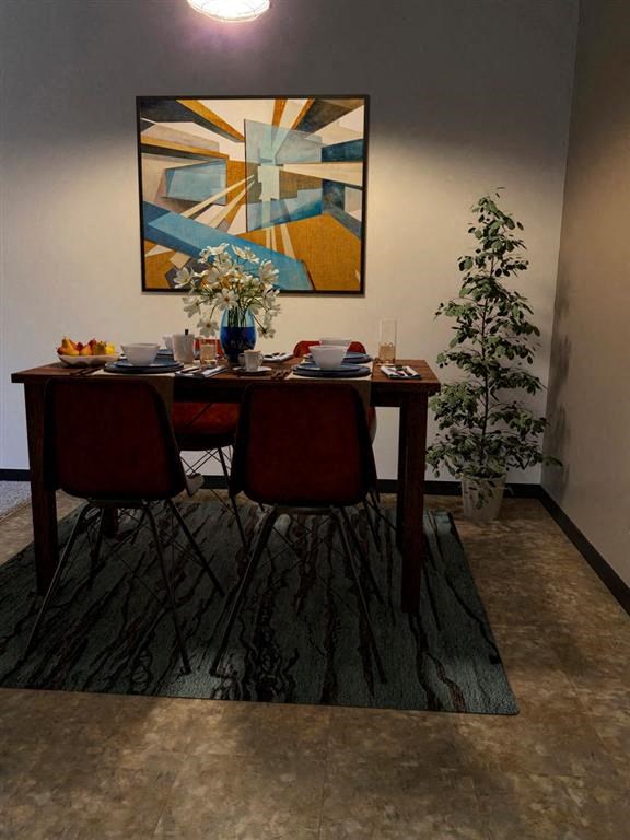 a table with a vase of flowers on top of it