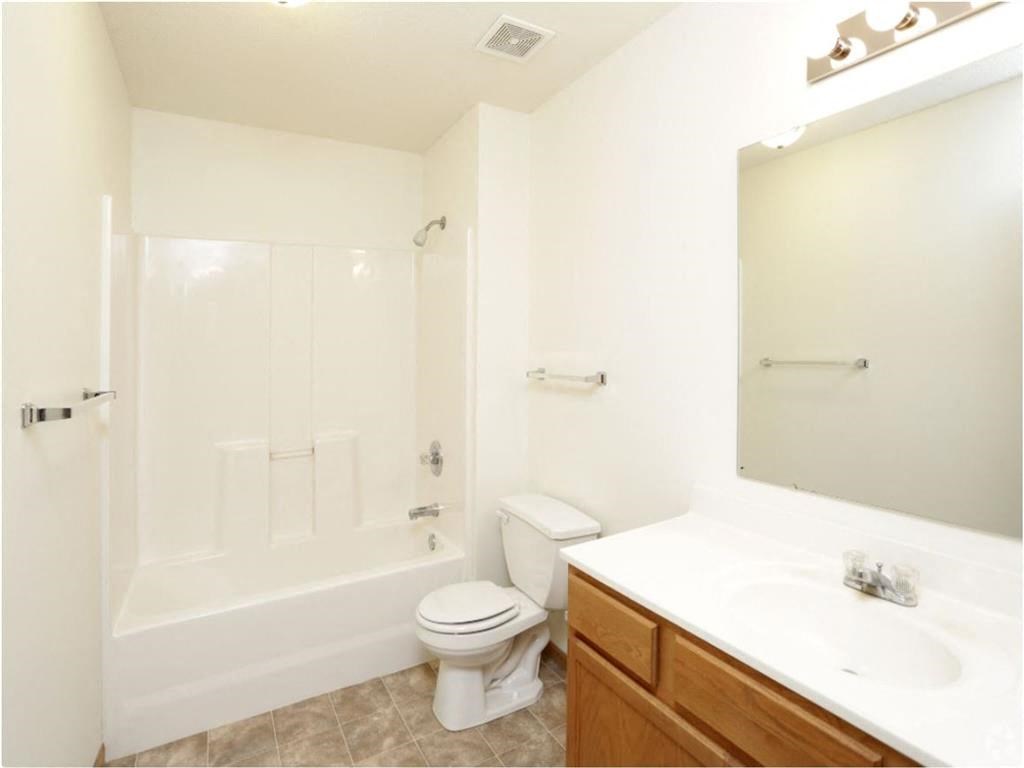 a bathroom with a sink toilet and bathtub