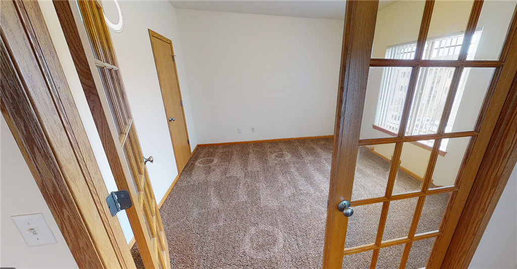 an open door leads into an empty room