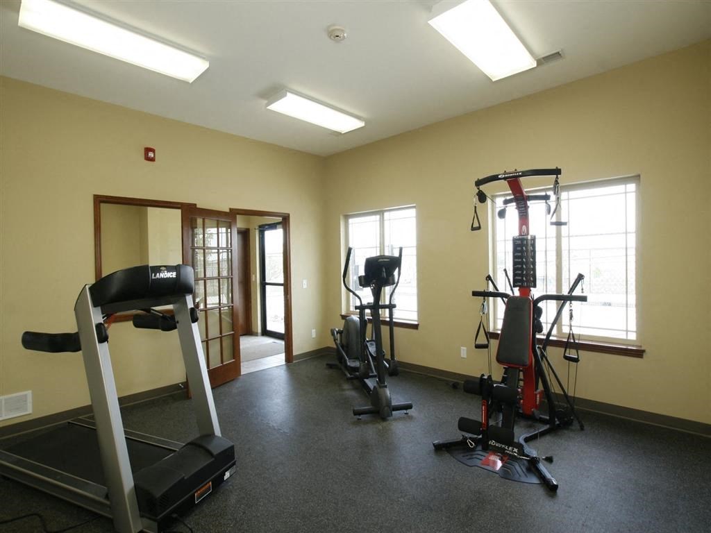 a room with a lot of exercise equipment in it