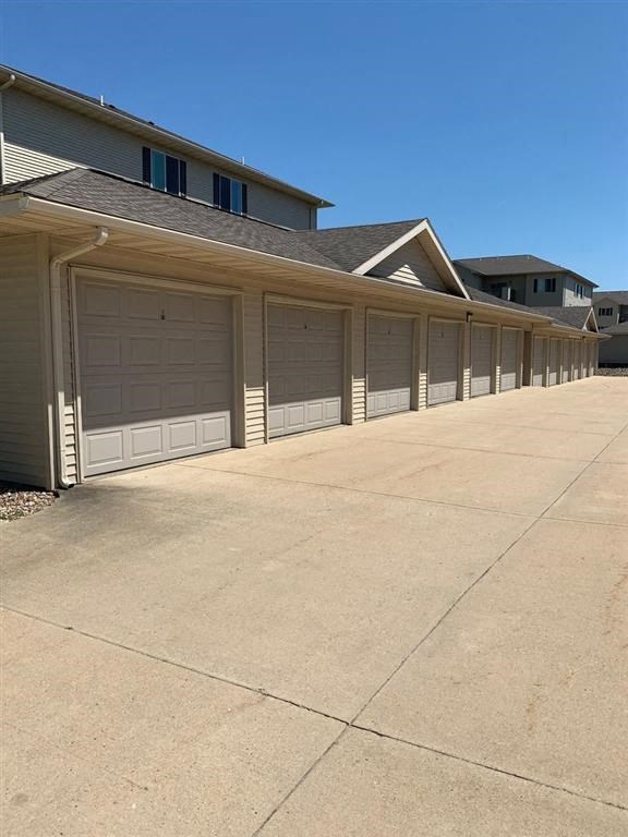 a row of garage doors on a house