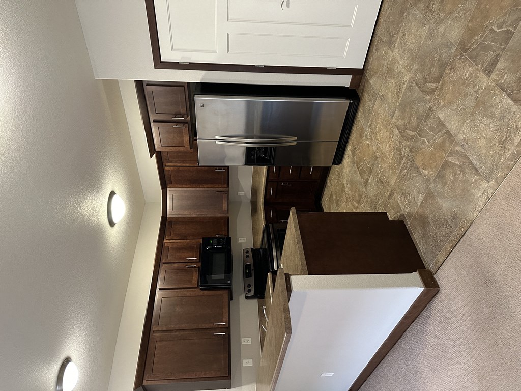 a view of the kitchen from the loft