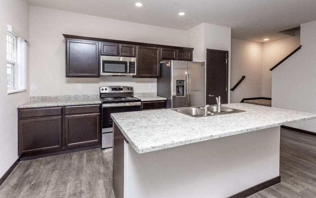a kitchen with a counter top and a sink