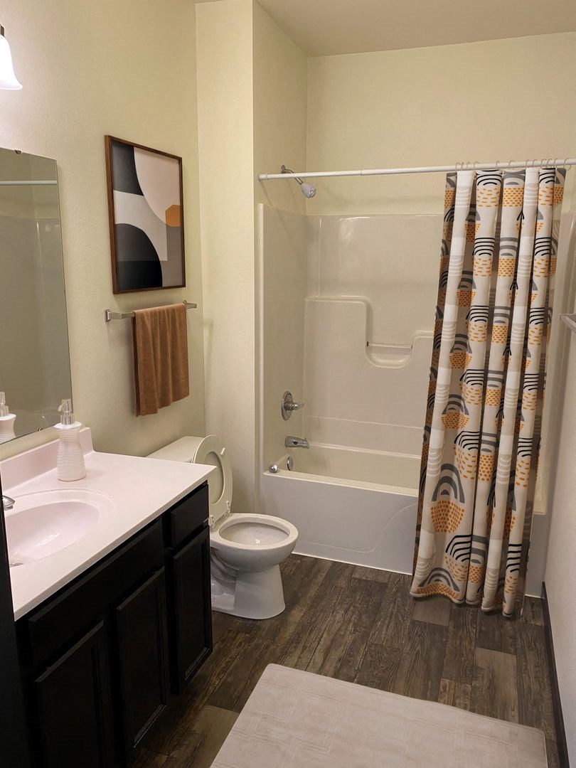 a bathroom with a toilet sink and bathtub