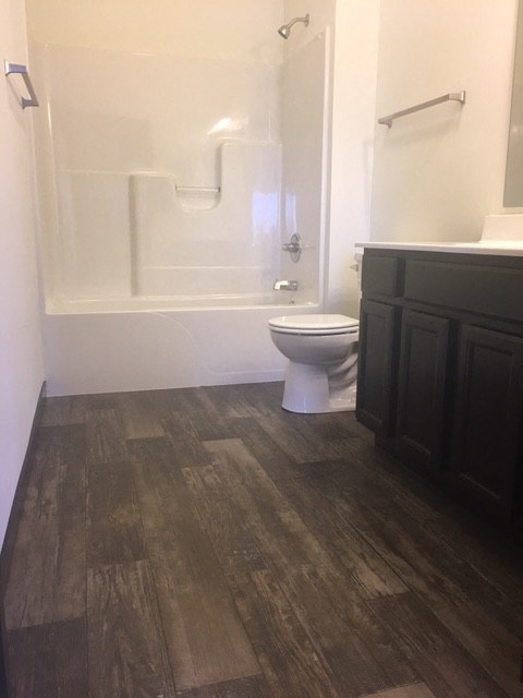 a bathroom with a toilet sink and bathtub