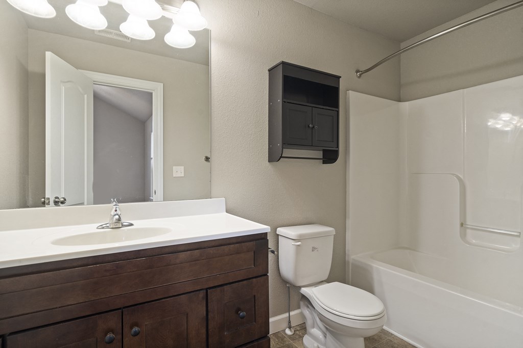 the preserve at ballantyne commons apartment bathroom with toilet sink and tub