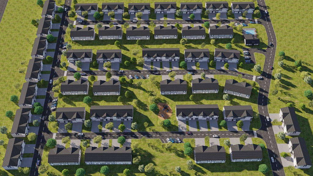 an aerial view of a subdivision with houses and trees