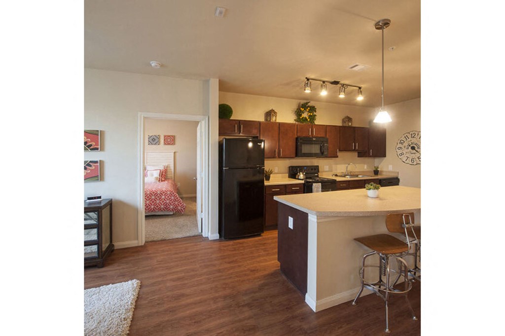 a kitchen with a center island and a stove top oven