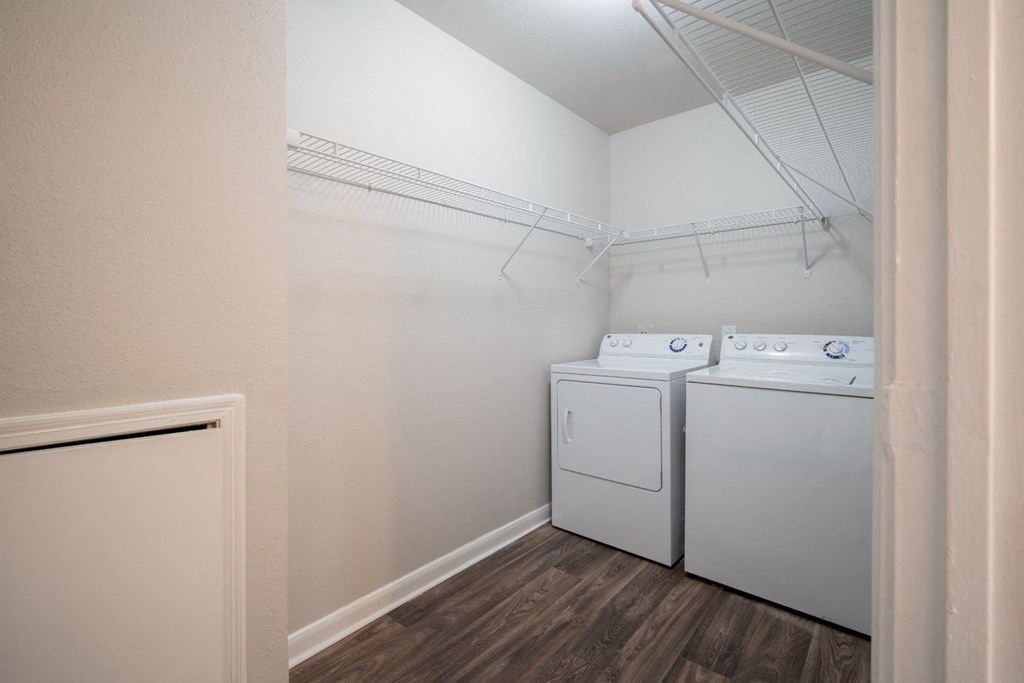 a room with a washer and dryer in it