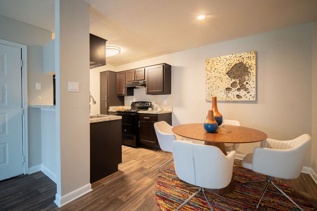 a kitchen and dining area in a 555 waverly unit