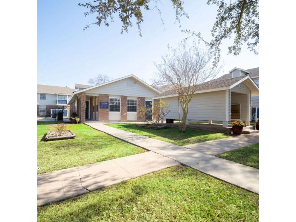 a house with a sidewalk in front of it