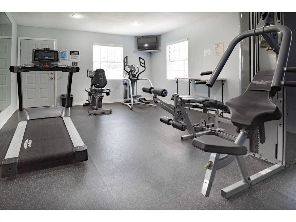 a room filled with lots of exercise equipment