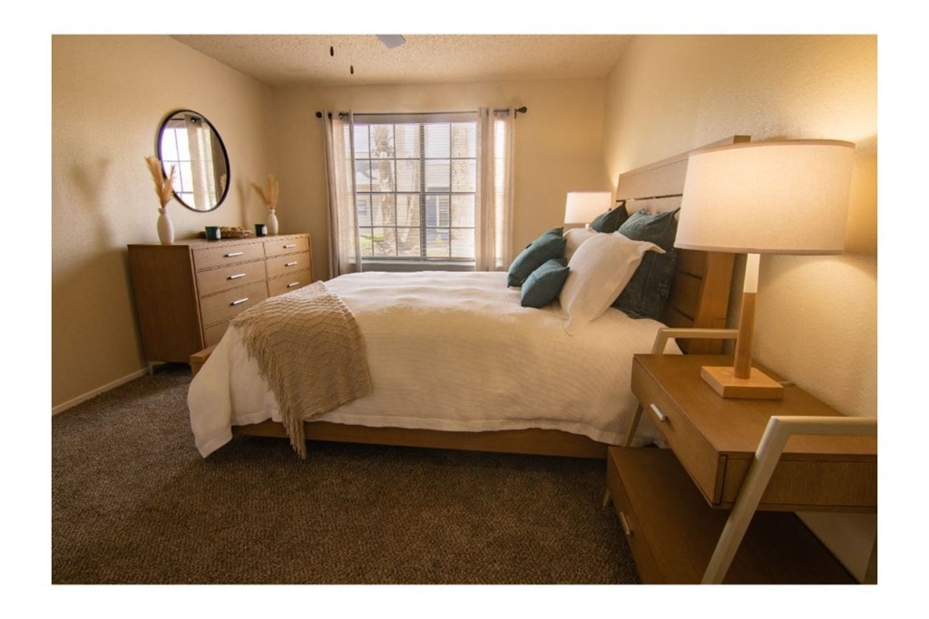 a bedroom with a bed and dresser