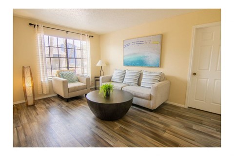 a living room with a couch and a table