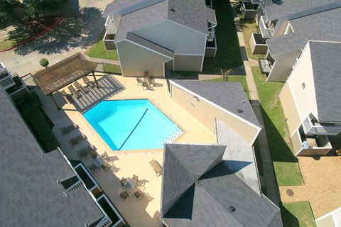 arial view of a house with a swimming pool
