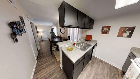 a kitchen and dining area in a 555 waverly unit