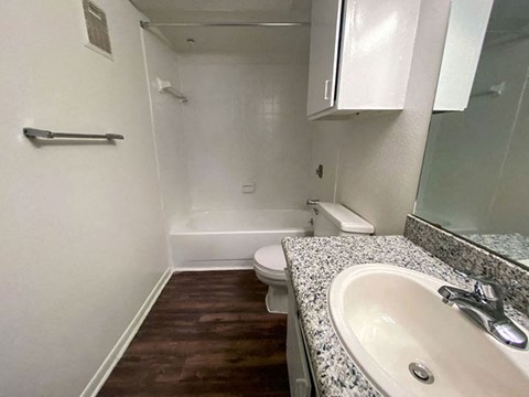 a bathroom with a sink toilet and bathtub