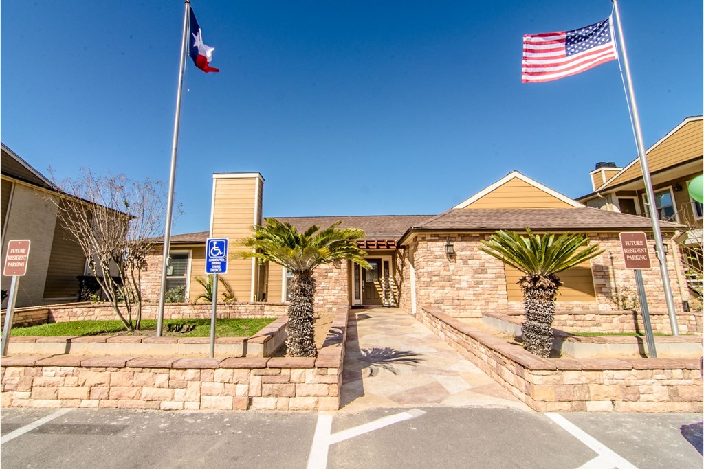 a building with two flags in front of it
