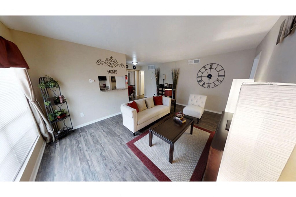 a living room with a large clock on the wall