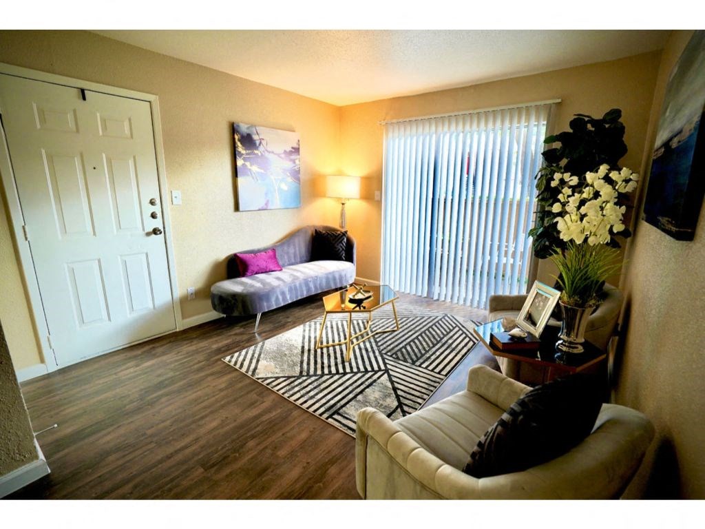 a living room filled with furniture and a rug