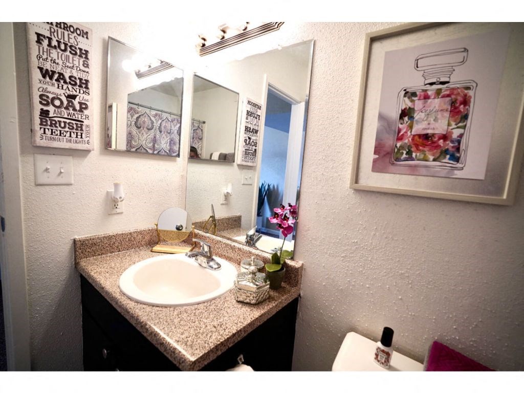 a bathroom with a sink and a toilet