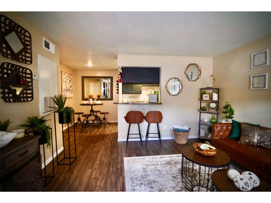 a view of the living room and kitchen of a 560 square foot, 1 bedroom apartment at