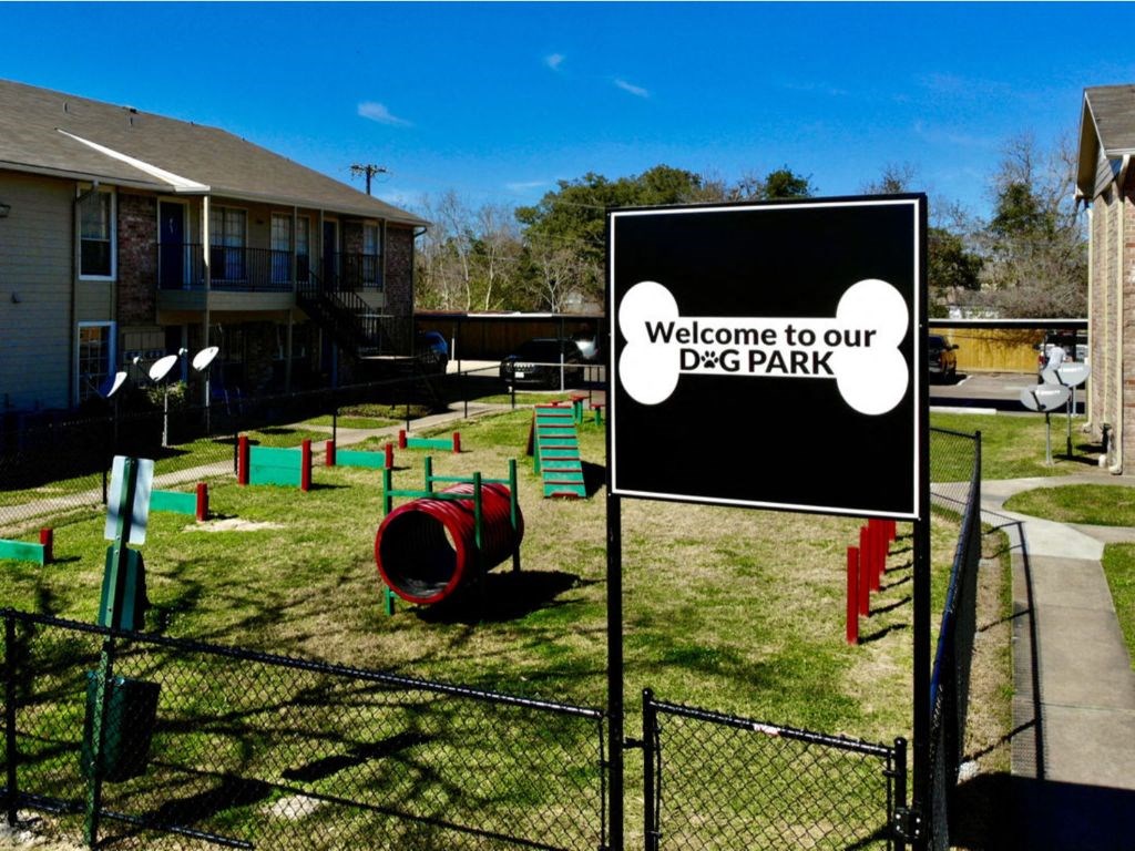 a sign that says welcome to our dog park