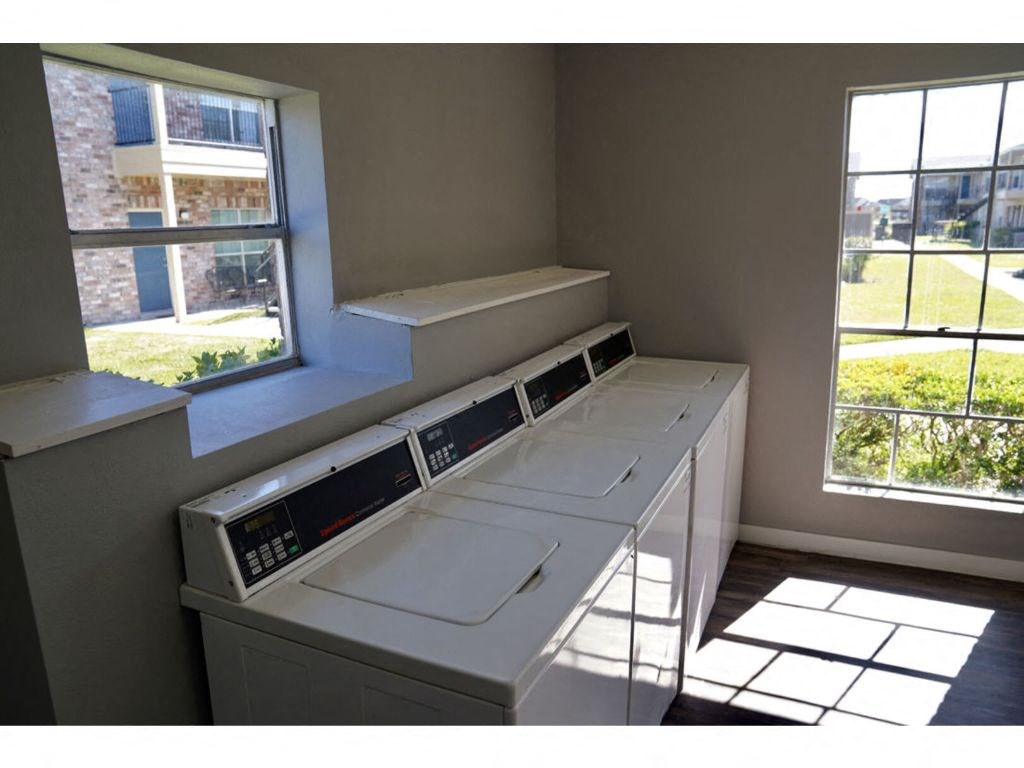 a washer and dryer in a room next to a window
