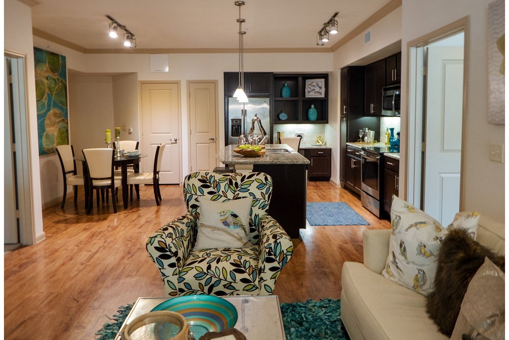an open floor plan with a kitchen and living room