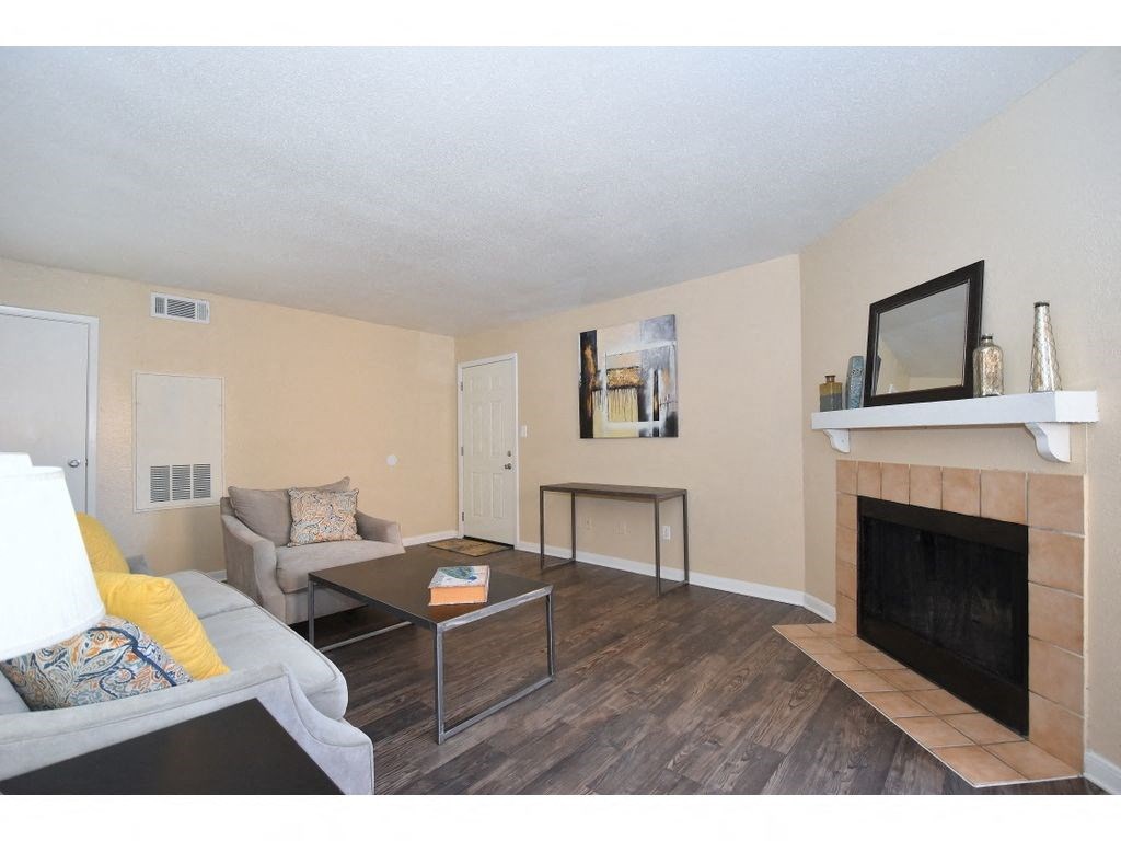 a living room with a fireplace and a couch