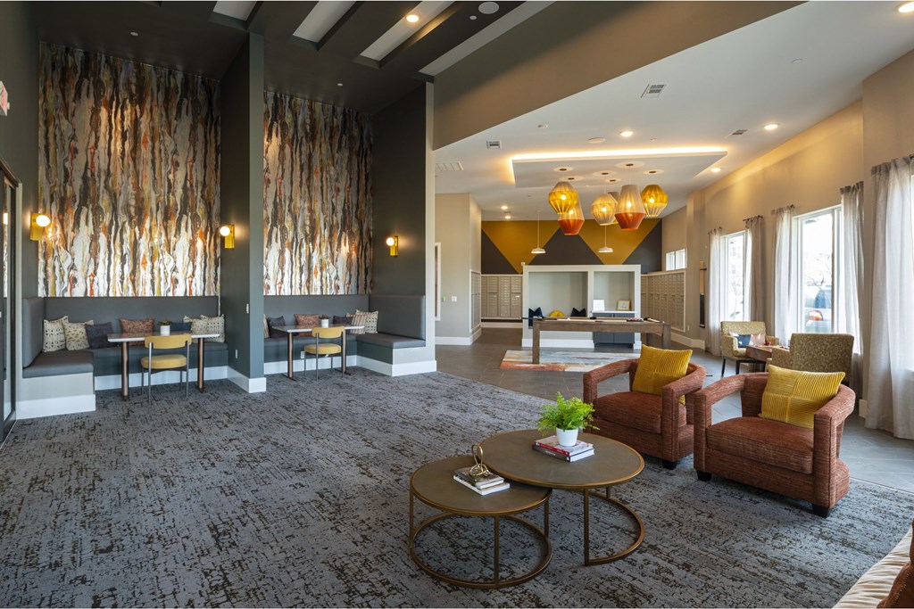 a living room filled with furniture and a large window