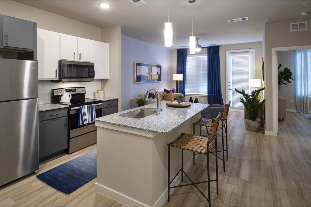 a kitchen and dining area in a 555 waverly unit