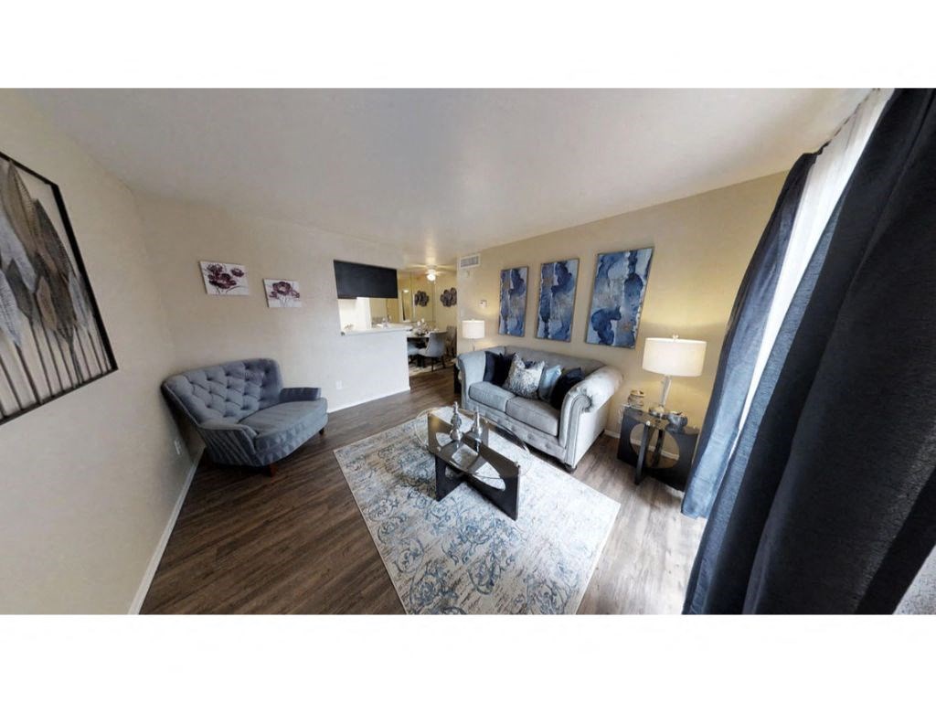 a living room with a couch and a chair
