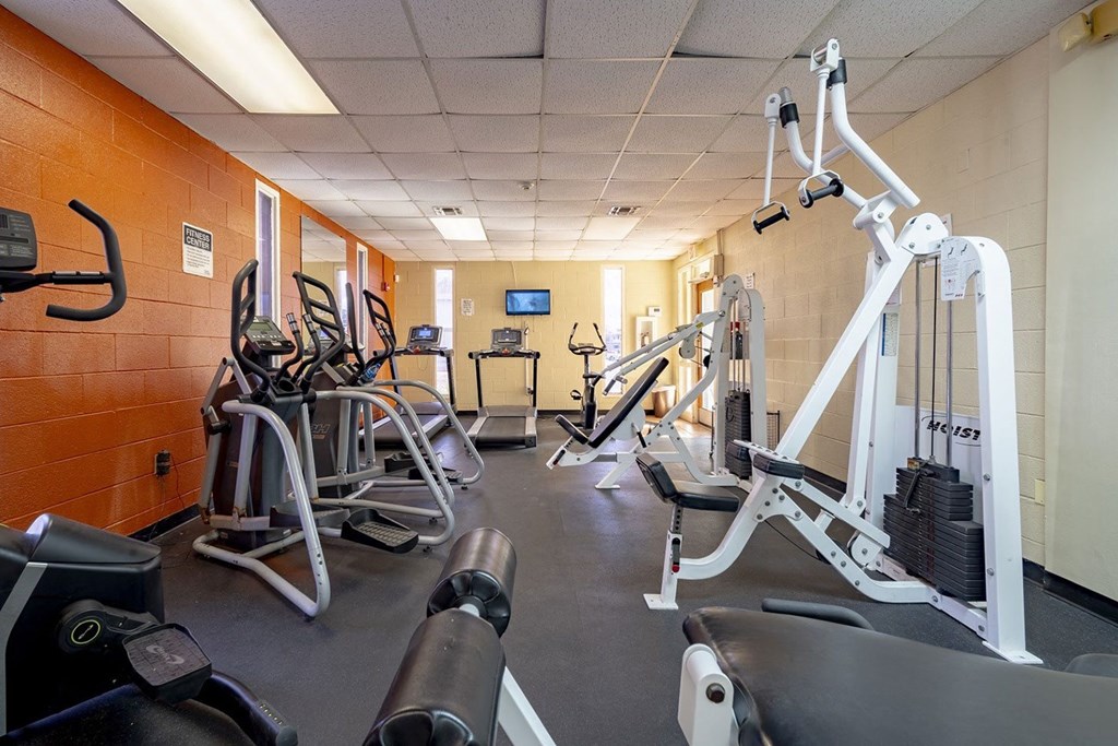 a room filled with lots of different types of exercise equipment