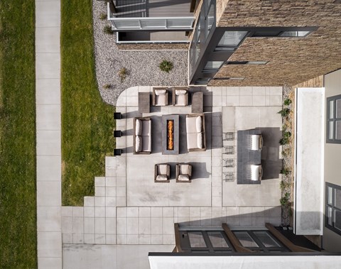 a birds eye view of a house with a yard and a courtyard