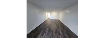 A long hallway with a light at the end.